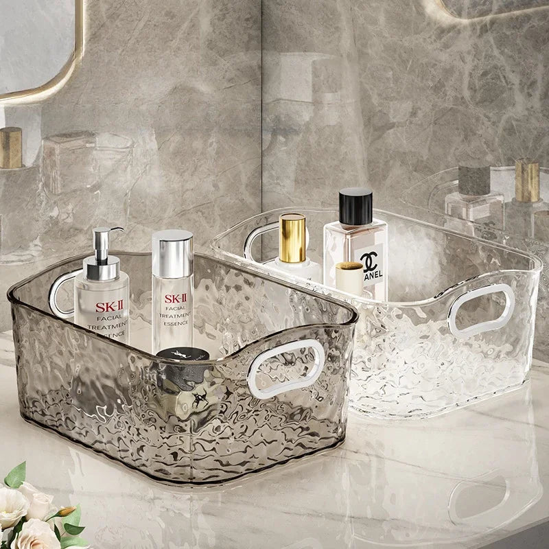 Clarify.pk foldable laundry hamper storage baskets in clear and smoky designs holding skincare bottles