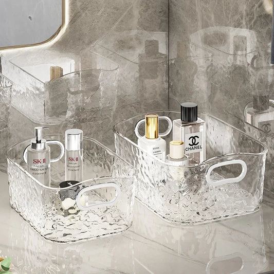 Clear foldable laundry hamper storage baskets from Clarify.pk holding skincare and perfume bottles