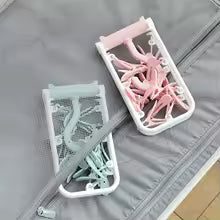Clarify.pk wide shoulder clothes hanger set in pastel pink and blue with foldable design