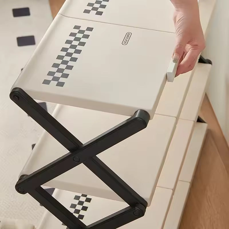 Clarify.pk folding shoe rack for home with sturdy black frame and beige shelves being folded by hand