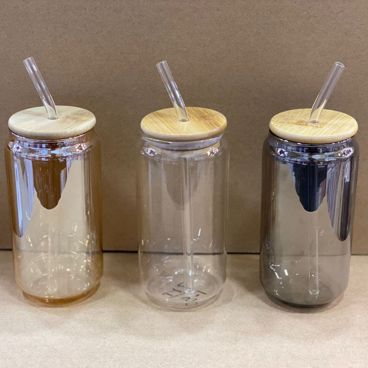 Set of three cups with bamboo lid iced coffee mug design and clear straws in different tinted glass colors