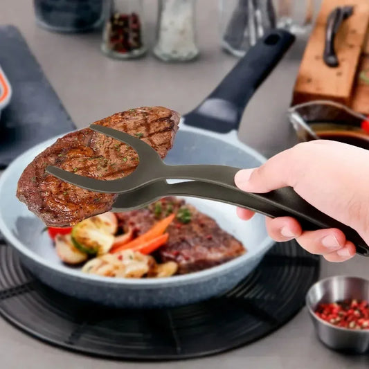 Clarify.pk 2 in 1 kitchen spatula holding grilled steak over a pan with cooked vegetables