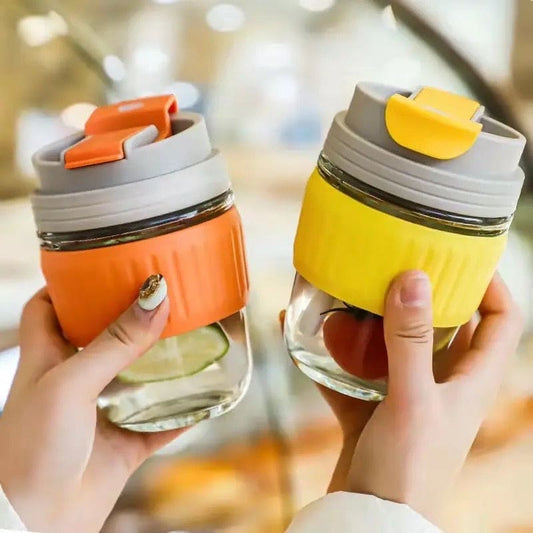 Clarify.pk 350ml cute travel mug in orange and yellow with silicone grip and flip-top lid