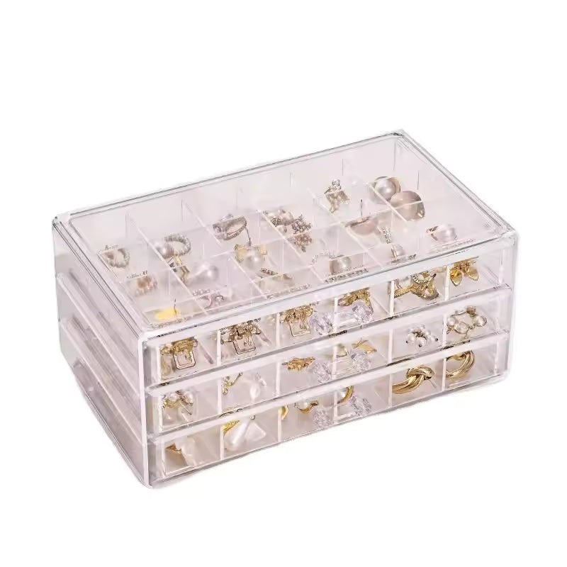 Clear acrylic drawer jewelry storage case with multiple compartments for organizing rings earrings and necklaces