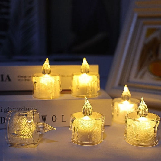 Clarify.pk acrylic LED candle lamp set glowing warmly on books in a cozy dark setting