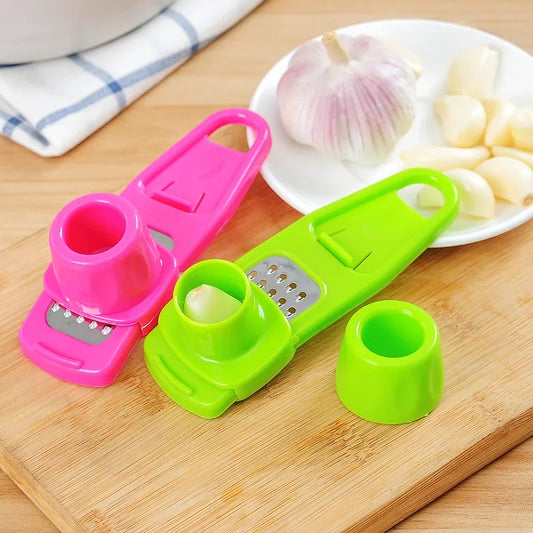 Clarify.pk colorful ginger garlic crusher tool set with green and pink handheld crushers on wooden board