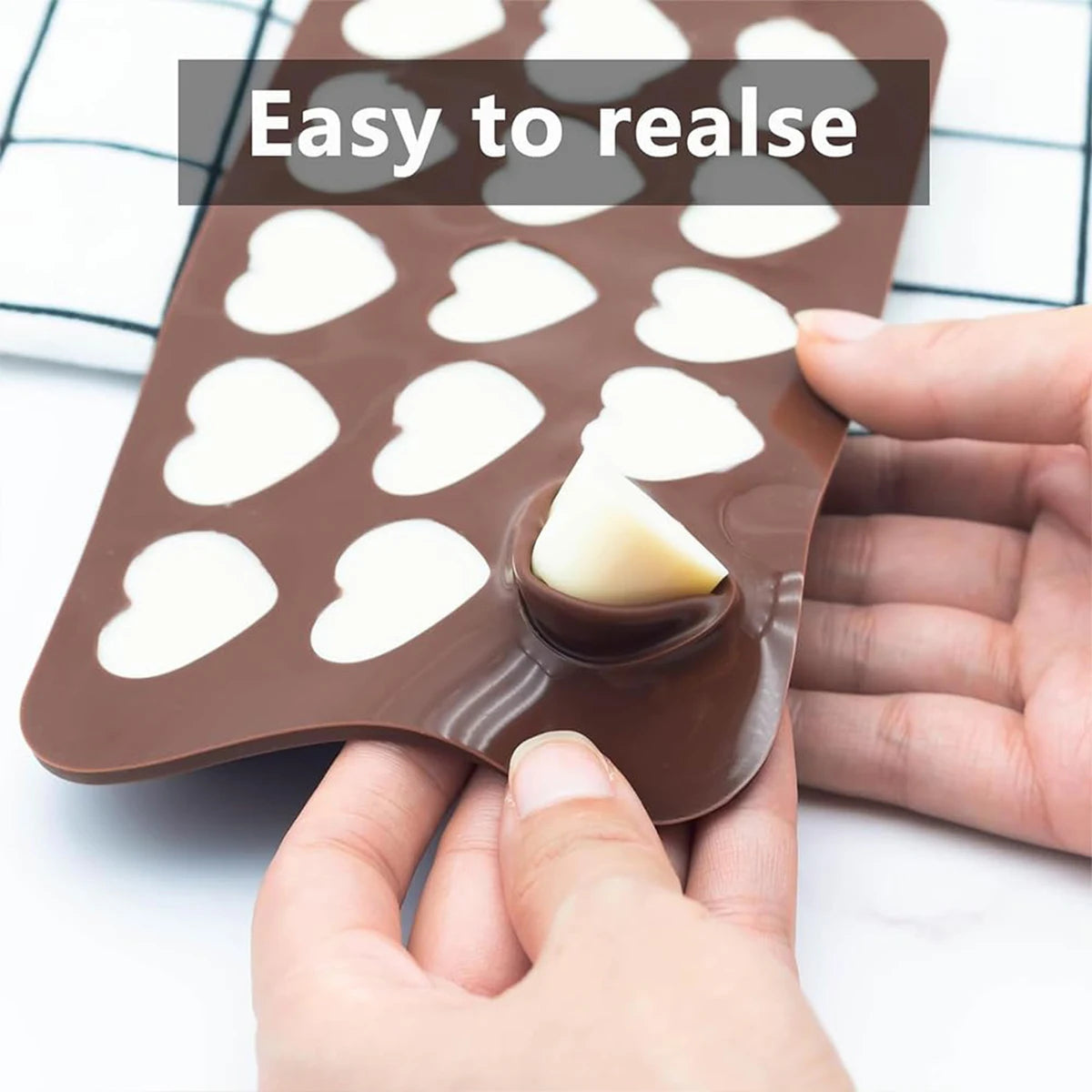Clarify.pk silicone chocolate mold with heart shapes being easily peeled for chocolates