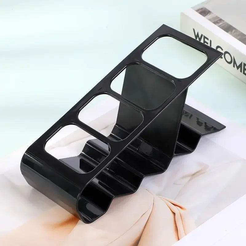 Black plastic TV remote stand holder with multiple slots for organizing remotes neatly