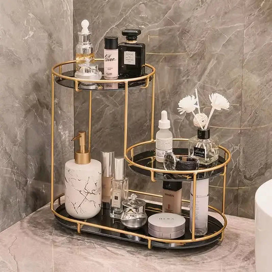 Clarify.pk bathroom furniture cosmetics organizer with gold frame and black shelves holding skincare and perfume bottles