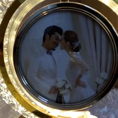 LED crystal moon photo lamp displaying a romantic wedding photo of a couple in formal attire