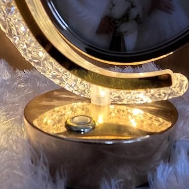 Close-up of LED crystal moon photo lamp base with glowing textured light and photo frame