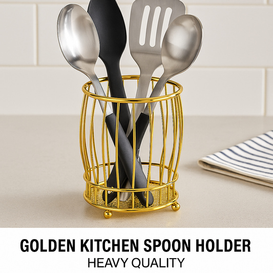 Golden kitchen spoon holder with metal bars holding stainless steel and black kitchen utensils