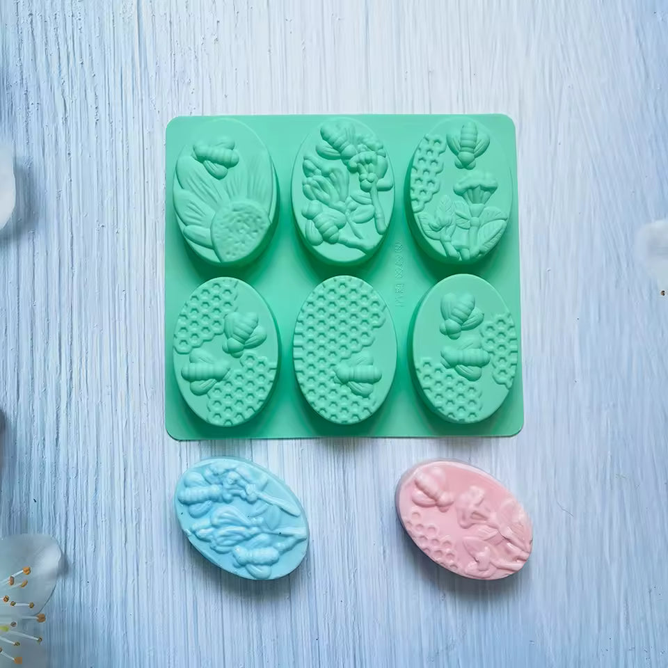 Clarify.pk 6 cavity oval soap mold in green with floral and bee designs for handmade soap crafting