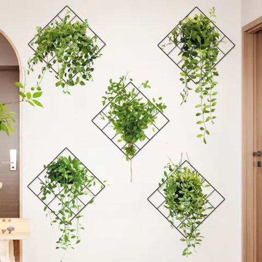 Modern interior wall decorated with green plant wall stickers in diamond-shaped black frames