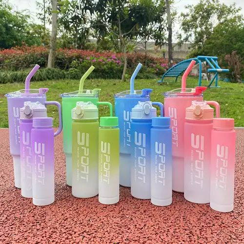 Clarify.pk 3 Pieces Water Bottle Set with colorful handles and straws displayed outdoors on red surface
