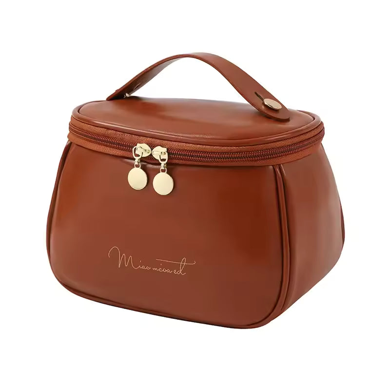 Clarify.pk brown PU leather handheld makeup wash bag with top handle and gold zipper