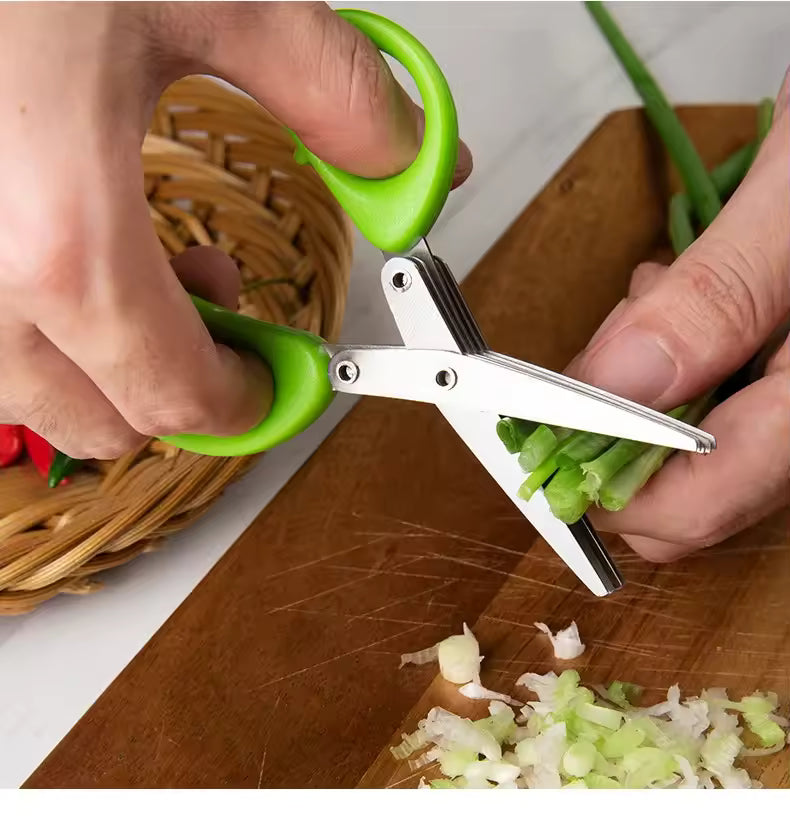 Clarify.pk 5 blade cutting scissors with green handles slicing green onions on wooden board