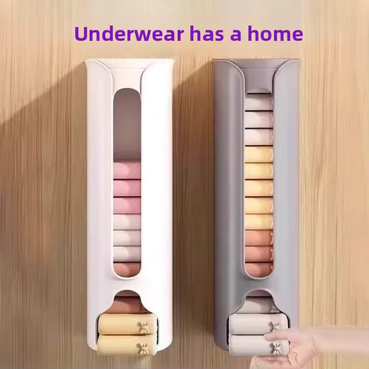 Wall-mounted hanging drawer organizer for socks in white and gray holding neatly folded socks