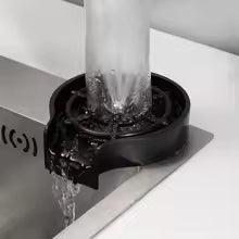 High pressure cup washer tool attached to faucet with water flowing through it by Clarify.pk