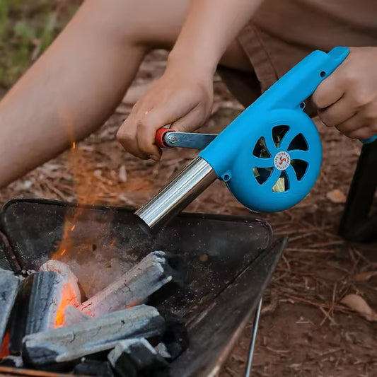 Clarify.pk high temperature resistant hand blower with blue body used to stoke fire in a charcoal grill