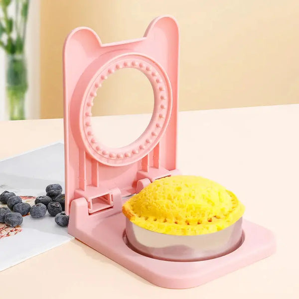 Pink plastic sandwich cutter and sealer for round stuffed sandwiches and snacks easy to press