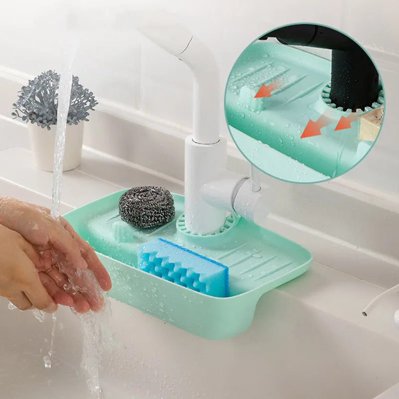 Clarify.pk silicone faucet mat in mint green holding sponge and scrubber under white kitchen faucet in sink