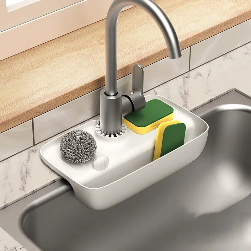 Clarify.pk silicone faucet mat and sponge holder attached to kitchen sink faucet with sponges and scrubber