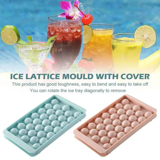 Round ice cube tray with cover in teal and pink, ideal for making durable ice cubes for drinks