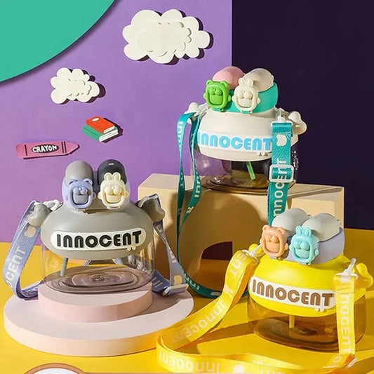 Colorful fun student drink tumbler 1200ml with playful character lids and adjustable straps by Clarify.pk