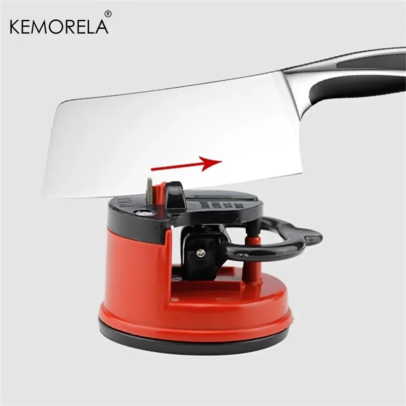 Red fine iron knife sharpener with suction base and black handle holding stainless steel cleaver