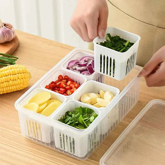 Clear fridge organizer container with multiple compartments for fresh vegetables and herbs
