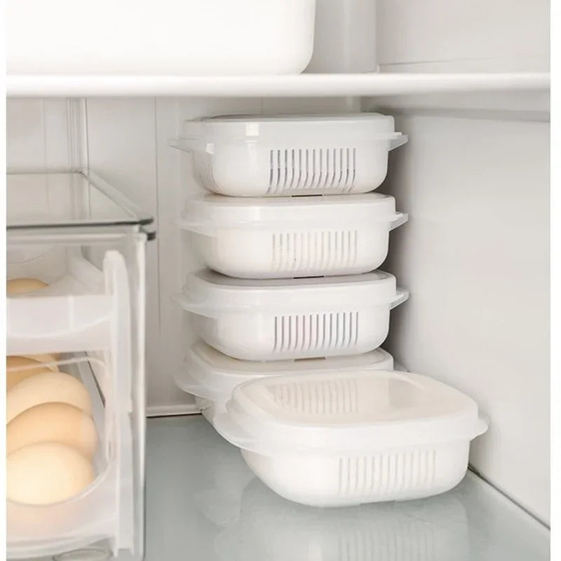 Set of stackable kitchen food storage containers in a refrigerator, ideal for organized food storage