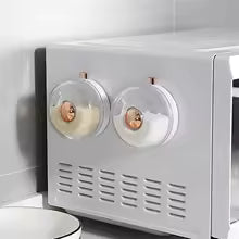 Clarify.pk kitchen magnetic spice jar set attached to microwave for easy herb and spice storage