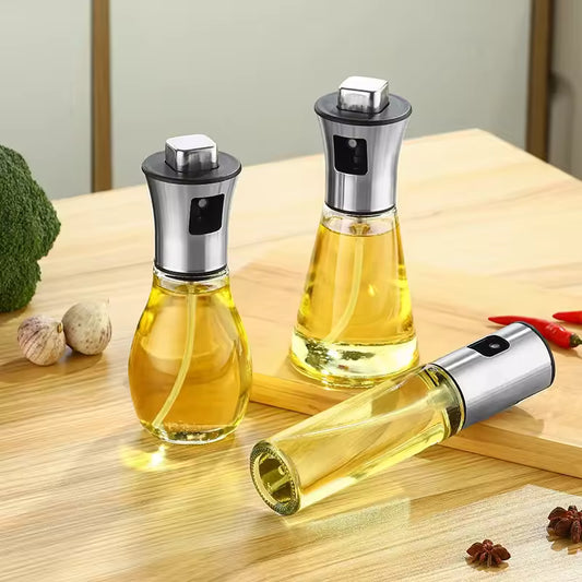 Clarify.pk kitchen oil sprayer for cooking with clear glass body and stainless steel top on wooden table