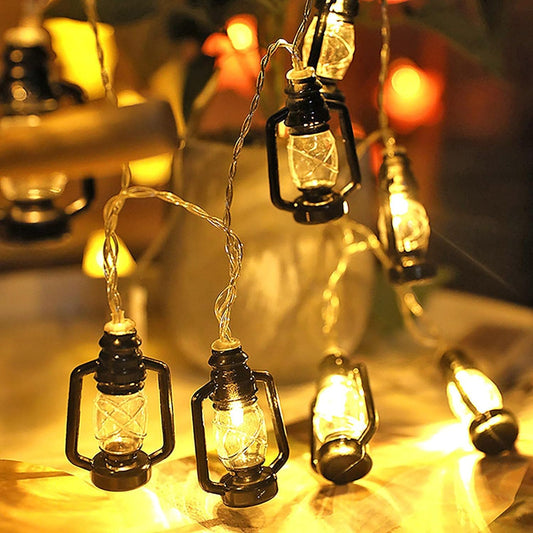 Warm glowing lantern string lights set with vintage-style black frames perfect for cozy indoor and outdoor decor