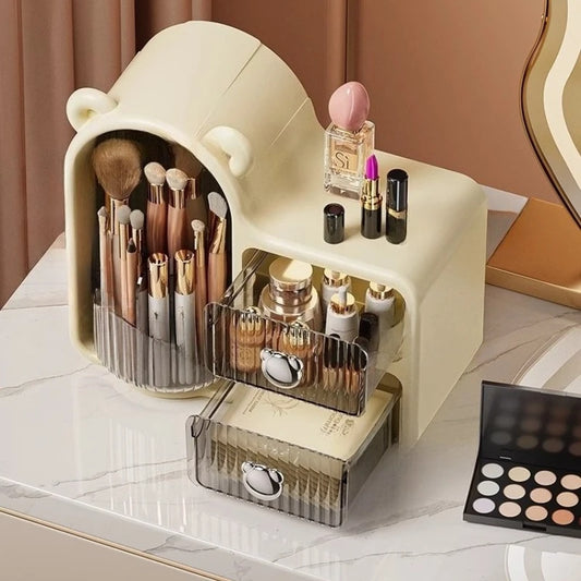 Large capacity cosmetic storage drawer by Clarify.pk holding makeup brushes, lipstick, and skincare products in a cream bear-shaped organizer