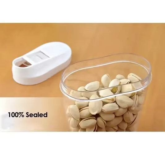 Clear airtight large capacity storage jars for pantry filled with pistachios with a white sealing lid