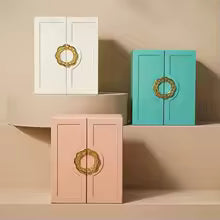 Large faux leather jewelry box in white pink and teal colors with decorative gold handles