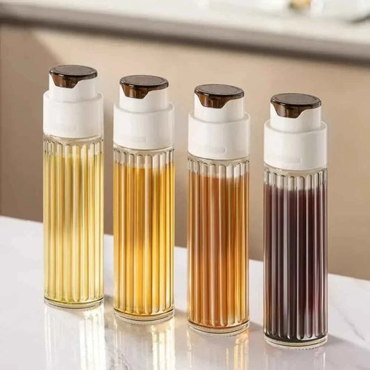 Set of four leak-proof glass oil jars with elegant ribbed design and easy-pour spouts