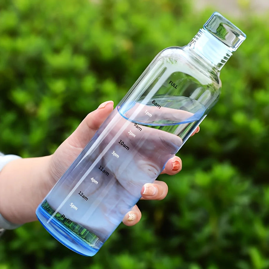 Clear Clarify.pk leakproof sport water bottle with hourly time markings held outdoors