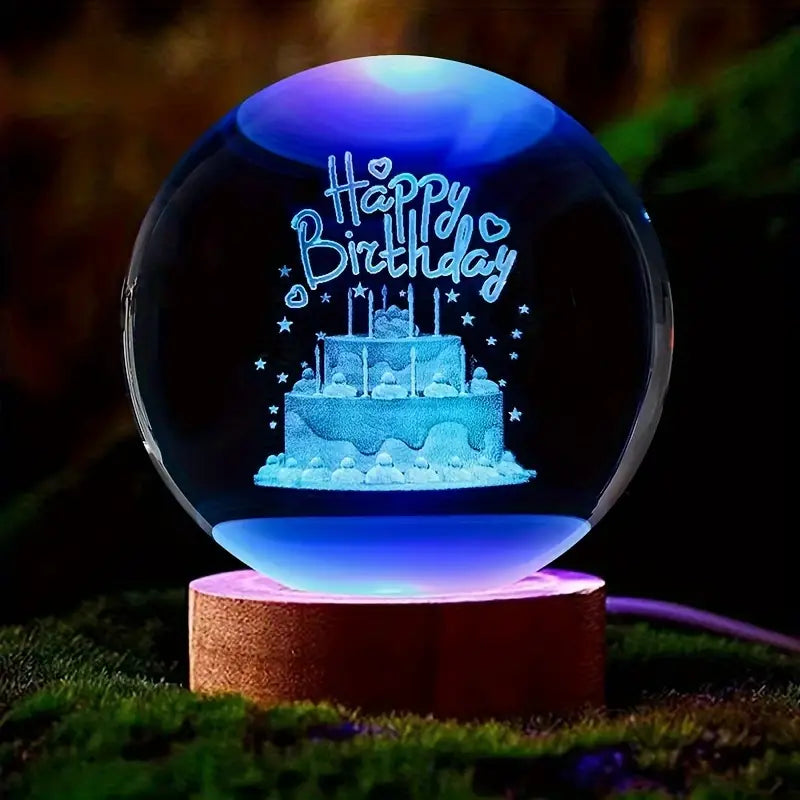 LED astronomy night light displaying a glowing Happy Birthday cake inside a glass sphere on a wooden base