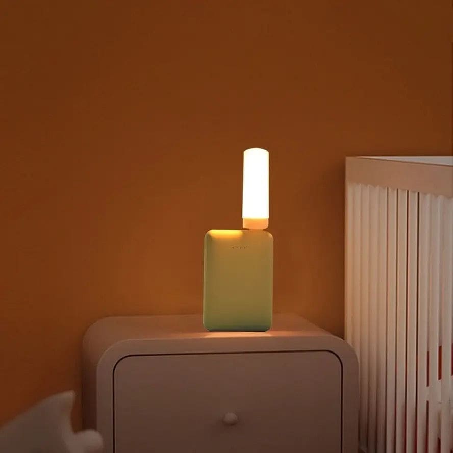 Clarify.pk LED flame effect night light with modern design on bedside table in warm room