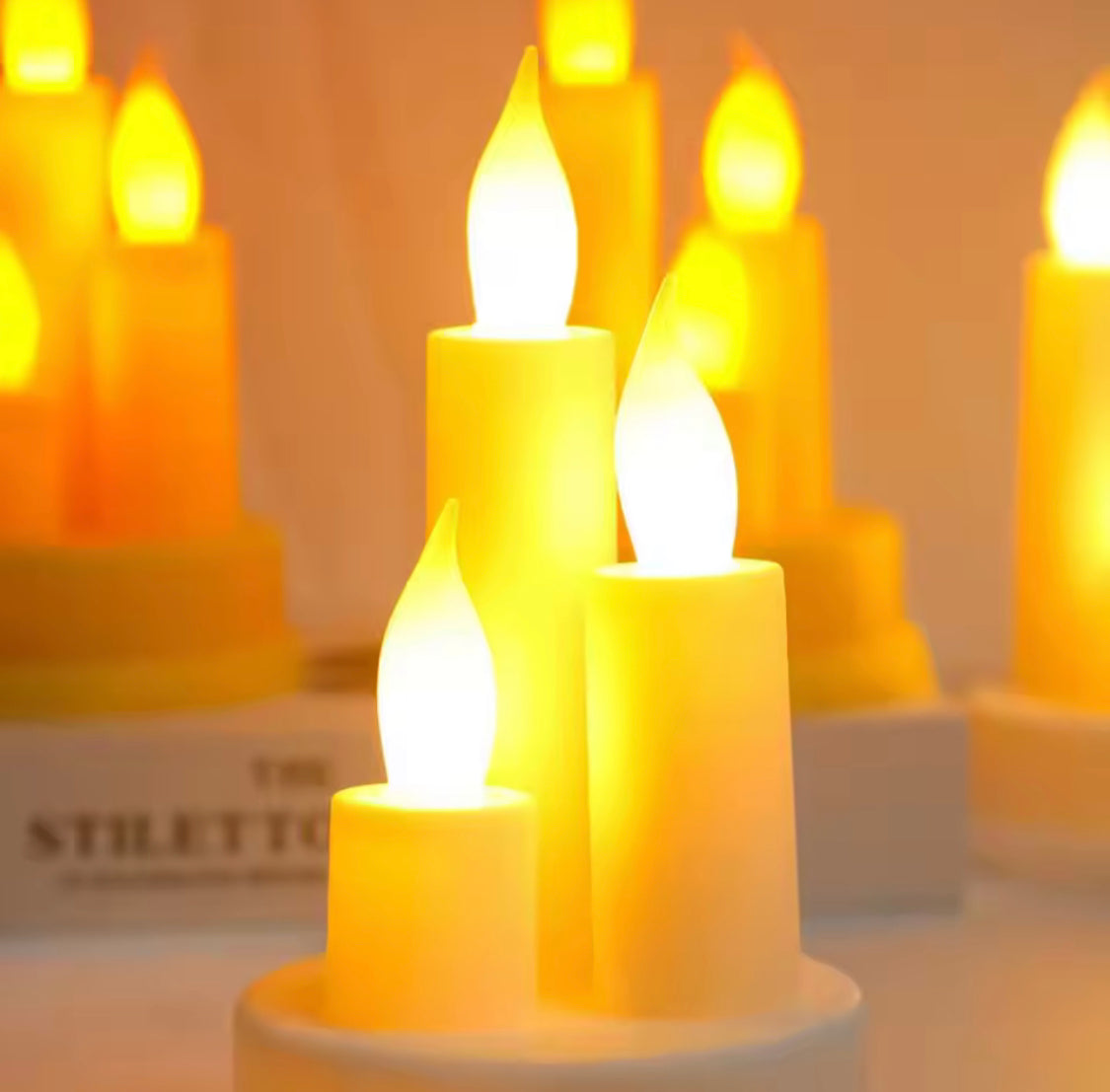 Set of LED flameless candles emitting warm light for home decor ambiance and safety