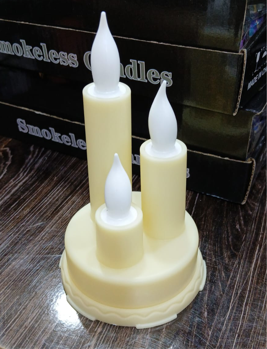 LED flameless candle for home decor in cream color with three varying height flame-shaped lights on a round base