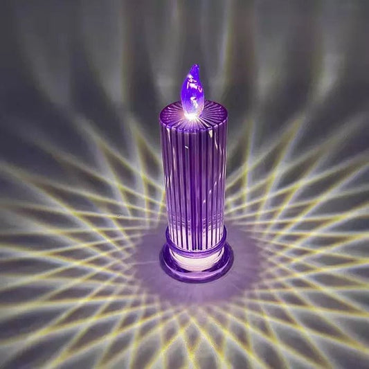 Purple LED flameless candle lamp casting decorative light patterns on a dark surface