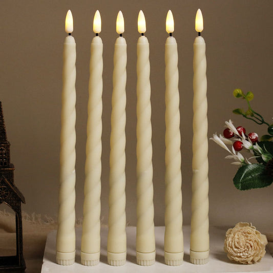 Set of six beige LED long candle lights with twist design standing upright on a white surface