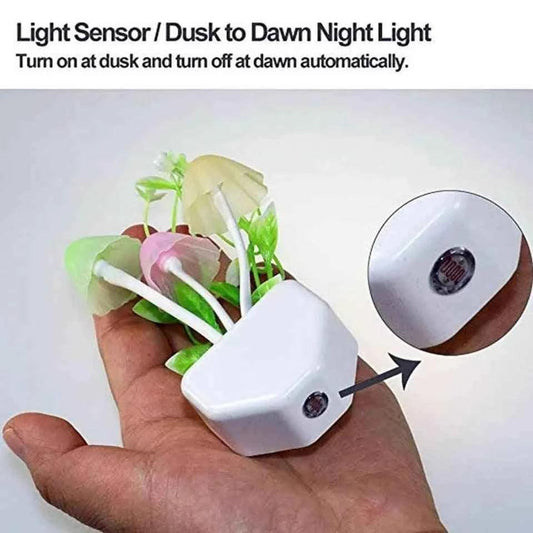 LED mushroom night light with light sensor and dusk to dawn automatic on off feature held in hand