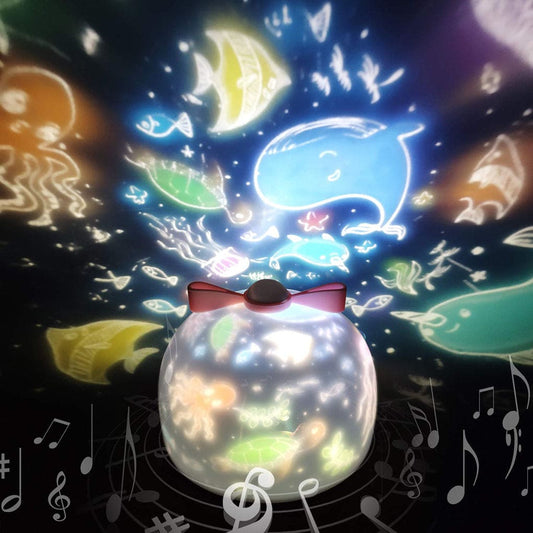 Clarify.pk LED night light projector displaying colorful underwater sea creatures and musical notes on the ceiling