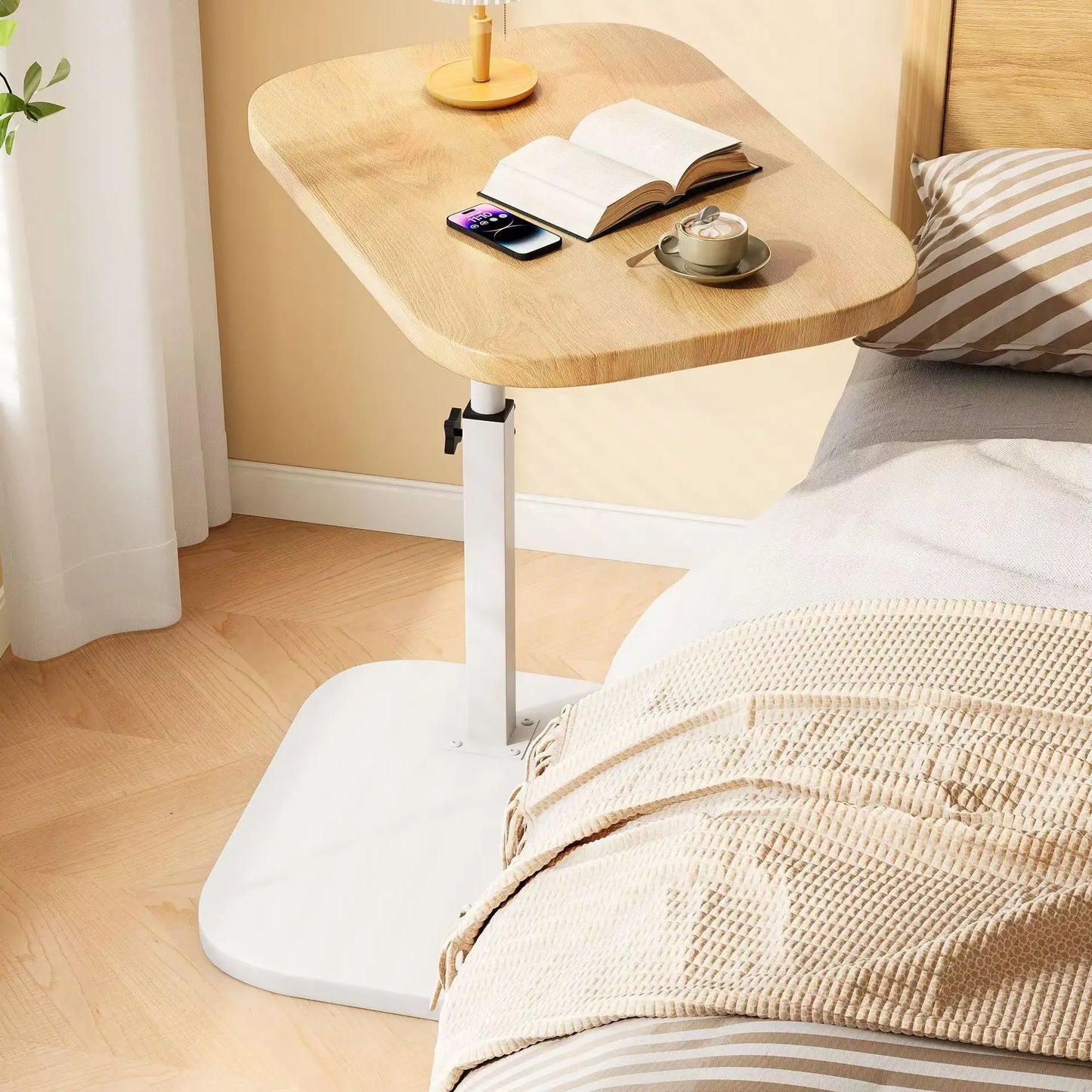 Clarify.pk lifting side table for living room with adjustable wooden top and white metal base beside a bed
