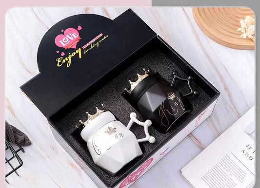 Couple mugs gift set with black King and white Queen mugs featuring crown lids and unique handles